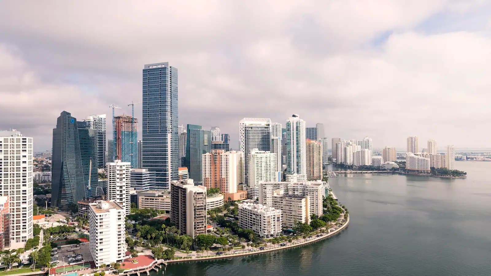 Aerial view of the Brickell high-rise district on the western edge of Biscayne Bay in Miami under a cloudy sky