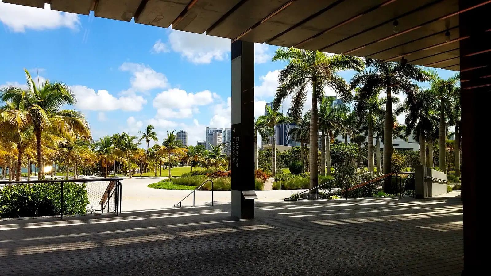 The deep slatted canopy of Pérez Art Museum Miami shading an open veranda above the bayfront lawn