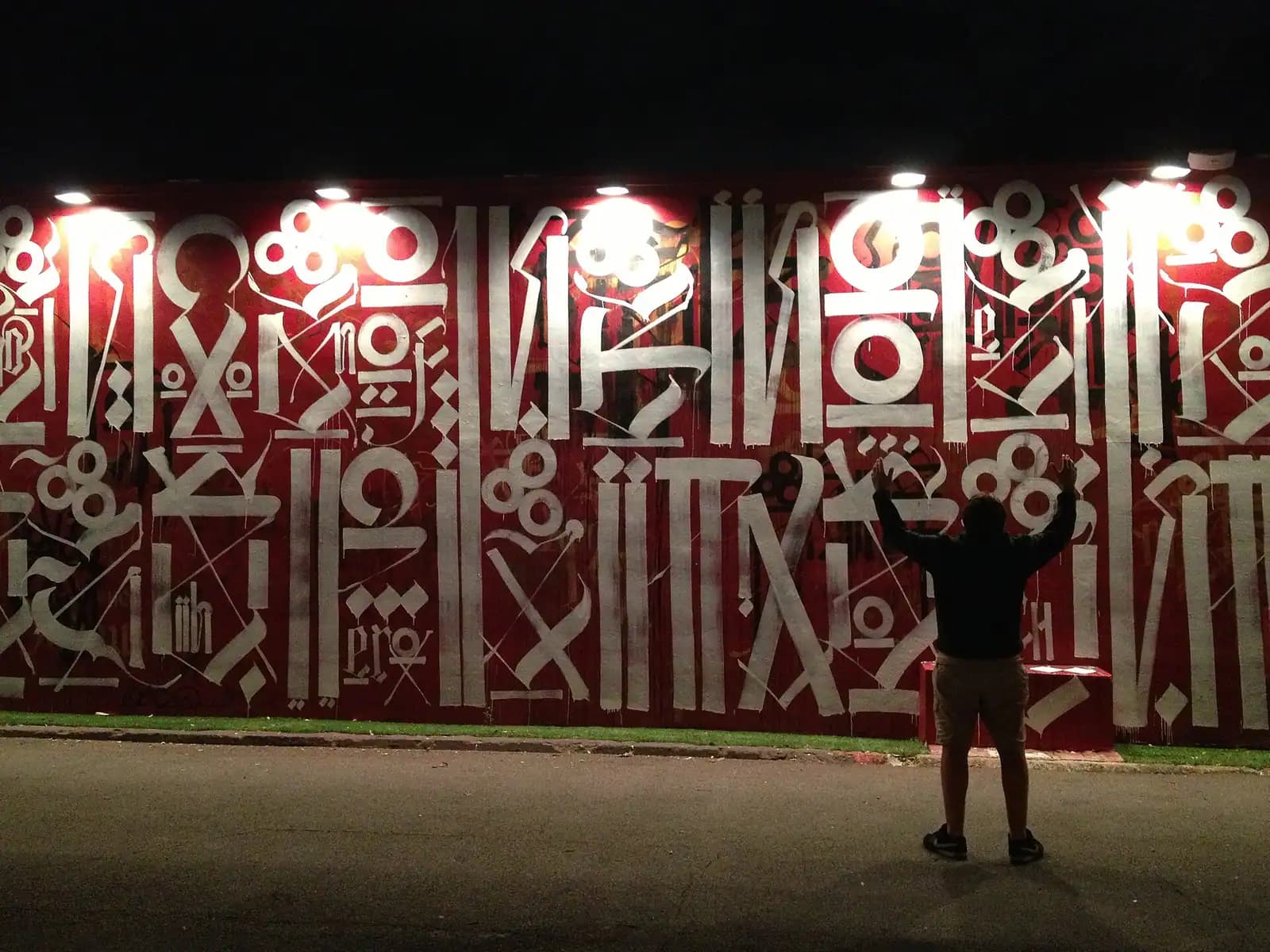 A large colourful mural covering the whole flank of a single-storey warehouse in Miami's Wynwood district